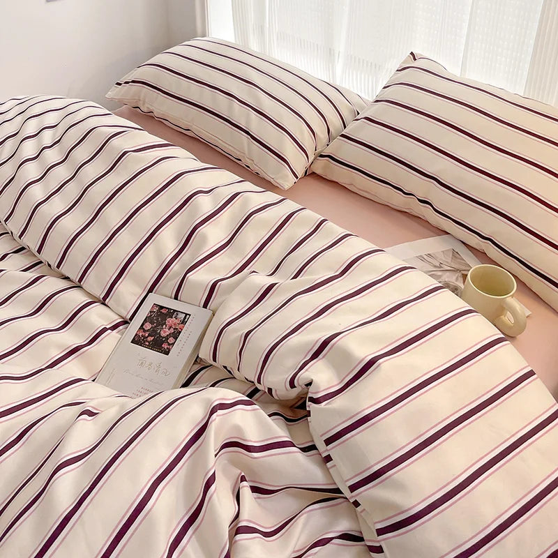 Simple Red and Blue Striped Duvet Cover and Four Piece Bed Sheet Set with Washed Cotton Bedding on the Bed
